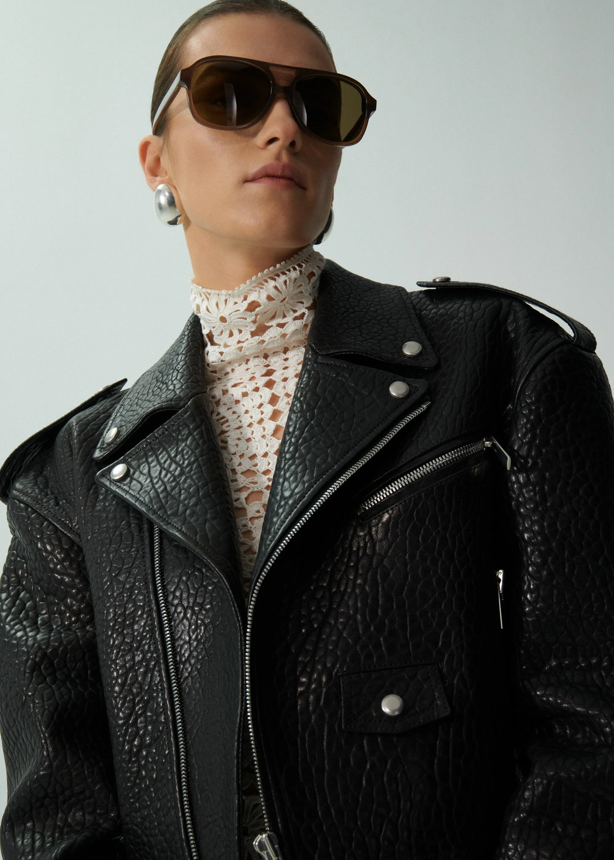 Cropped leather biker jacket in embossed black